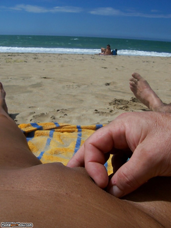 Porn Pics Spreading her legs on the beach