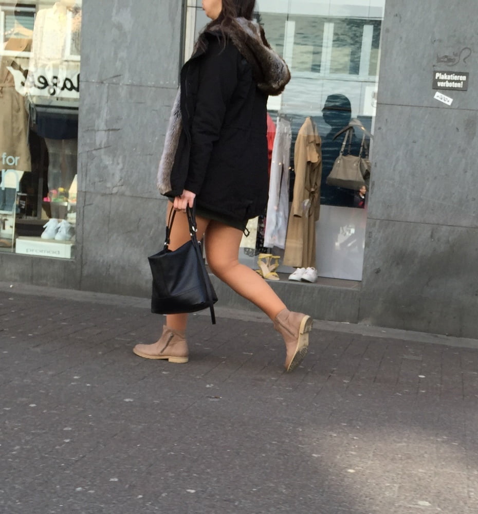 Cute lady in tan pantyhose and brown ankle boots- 24 Photos 