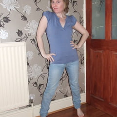 Cute Blonde Posing In Jeans And Shirt