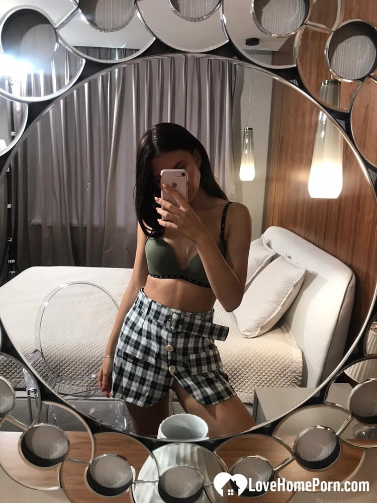 Hot schoolgirl reveals her tits in the mirror - 26 Photos 