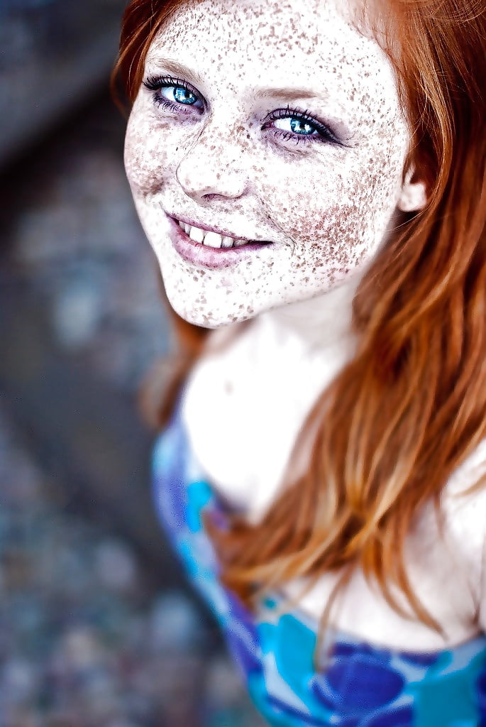 Freckled face red haired teenager with big boobs
