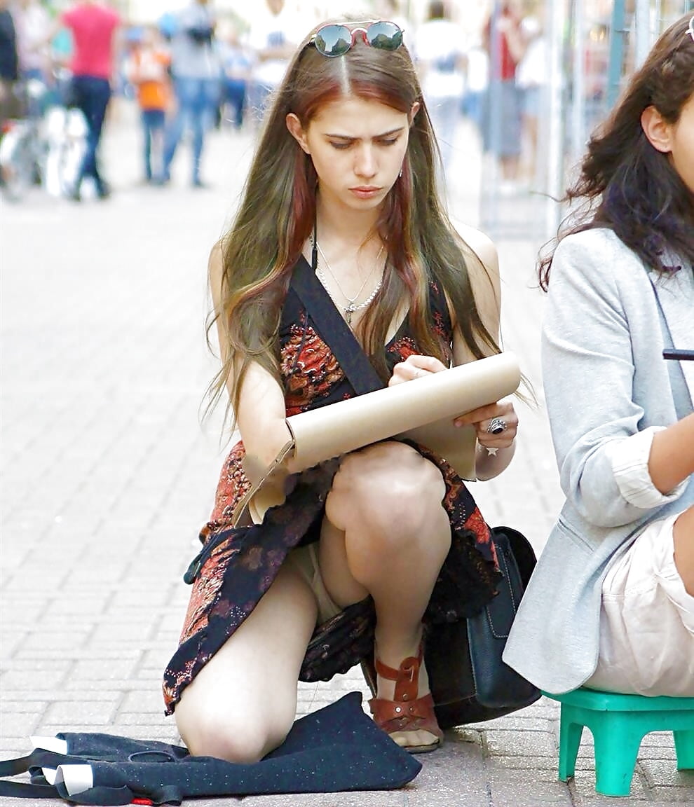Girl Sitting In The Street