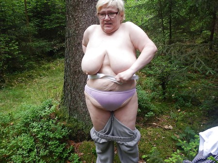 Busty granny in forest