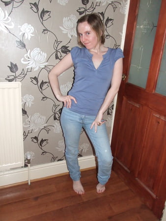 cute blonde posing in jeans and shirt         