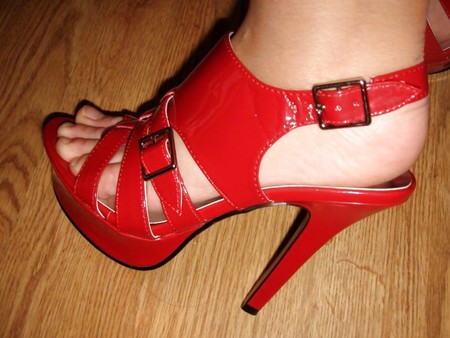 wifes feet in red heels